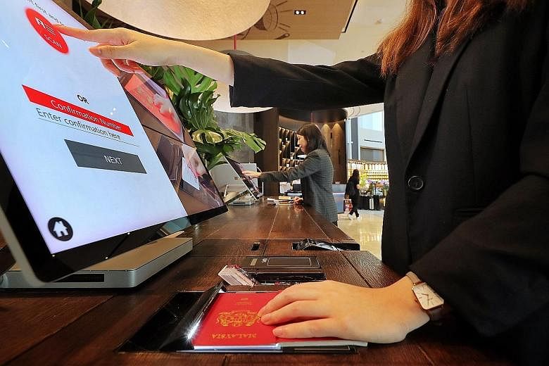 The E-Visitor Authentication system is being piloted at three hotels in Singapore, including Swissotel The Stamford (left).