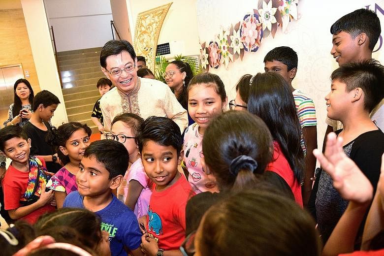 Deputy Prime Minister Heng Swee Keat with children from Sunlove Home during the largest interfaith leaders' Deepavali celebration at PGP Hall in Serangoon Road yesterday. Mr Heng, who is also Finance Minister, joined 150 guests from 10 different fait