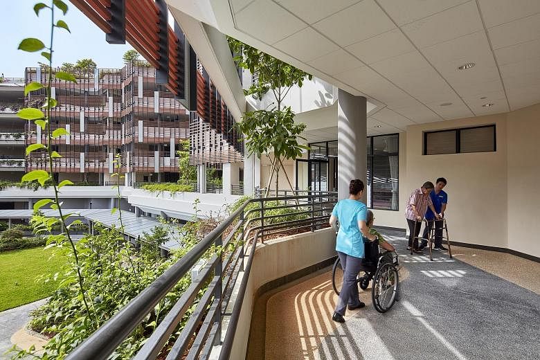 A chapel (above) is the heart of St Joseph's Home, which now offers wider corridors that also look out to greenery (left). Designed by Singapore-based architecture practice SAA Architects, St Joseph's Home's redevelopment was completed in end-2016.