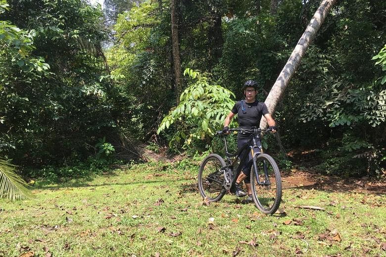 An avid mountain biker, Dr John van Wyhe (above) found this dead lined blind snake in Bukit Timah Nature Reserve on Sept 16, during one of his regular rides.