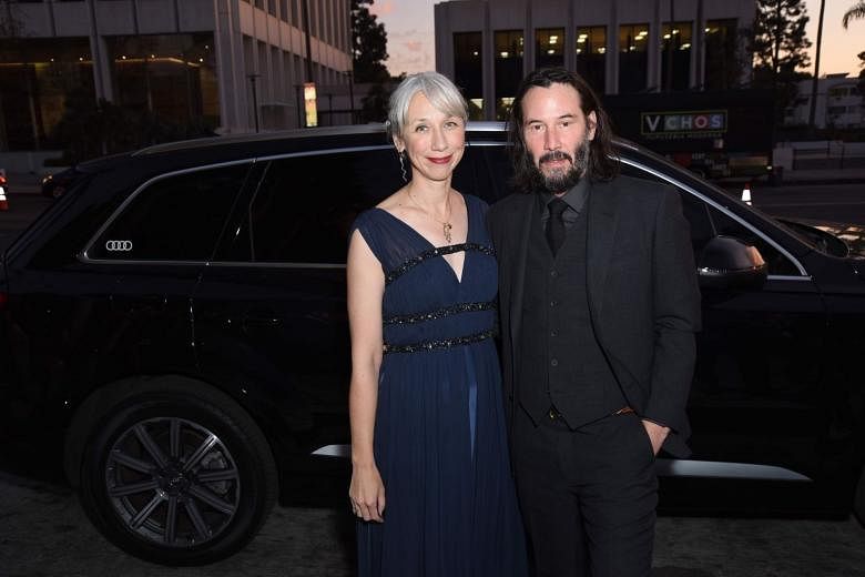Actor Keanu Reeves (above) with girlfriend Alexandra Grant, who is said to look like actress Helen Mirren. 