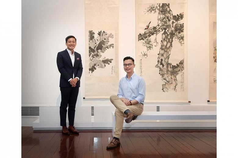Asian Civilisations Museum director Kennie Ting (left) with Mr Conan Cheong, curator of the exhibition, Living With Ink: The Collection Of Dr Tan Tsze Chor. 
