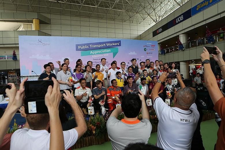 Transport Minister Khaw Boon Wan (centre) at a transport workers' appreciation event in Toa Payoh yesterday. Students from different schools joined in showing their appreciation for transport workers by helping to make goodie bags for them. PHOTOS: L