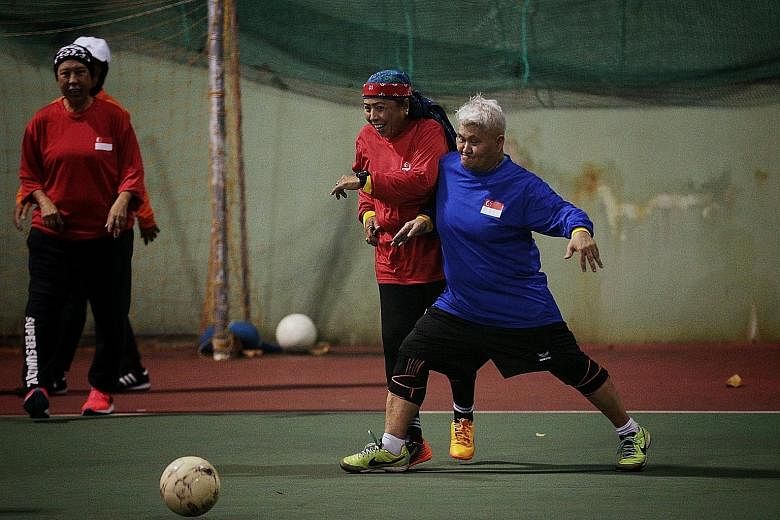 Sexagenarians Maimun Wahab (in blue) and Merah Ahmad challenging for the ball during a walking football session at Evans Road last month. They are part of 4 Ever Young The Legends, a team comprising former national women's footballers who come togeth