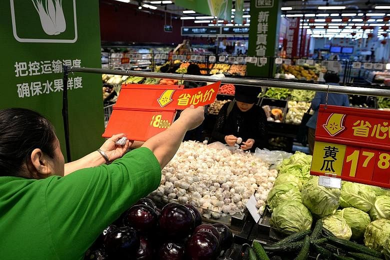 A Walmart supermarket in Beijing in September. The China-US trade war and declining demand are taking their toll on China's manufacturing sector. Policymakers are racing against the calendar to meet China's annual growth target as the world's second 
