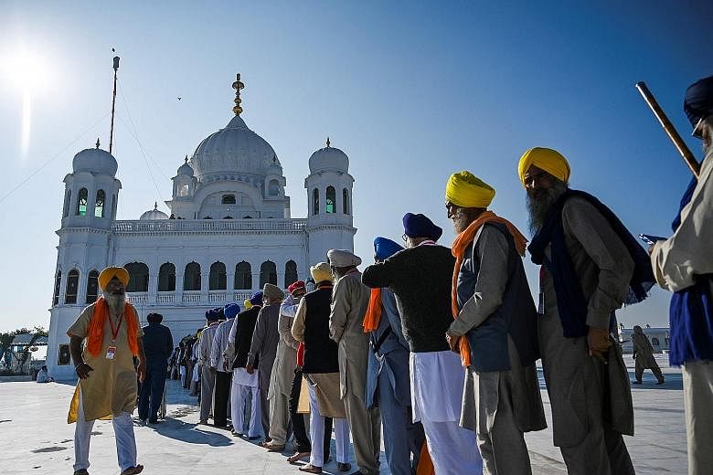 Pilgrims queueing yesterday to visit the shrine of Sikhism's founder Guru Nanak in Kartarpur, Pakistan, after a landmark deal that allows Indian Sikhs access to one of their religion's holiest sites.