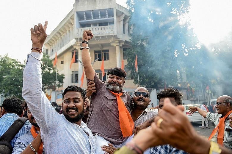 Indian Prime Minister Narendra Modi has fulfilled two out of three election pledges to his Hindu base, just a few months after his re-election. Supporters of a Hindu militant organisation celebrating after the Indian Supreme Court last Saturday award