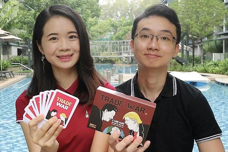 Ms Lai Yi Xuan and Dr Lin Zhiyong with the Trade War Card Game they created to make the US-China trade war easier to understand and more relatable to people. The couple plan to launch the game on crowdfunding platform Kickstarter next Tuesday.