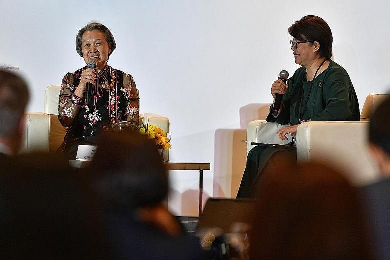 Temasek chief executive Ho Ching (left) speaking at the 11th Global Compact Network Singapore summit yesterday, with the network's president Goh Swee Chen.