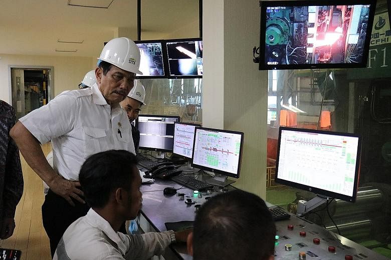 Indonesia's Coordinating Maritime Affairs and Investment Minister Luhut Pandjaitan on a working visit to a nickel processing plant in Morowali, Central Sulawesi. He has been credited with turning the sleepy town into the world's largest nickel indust