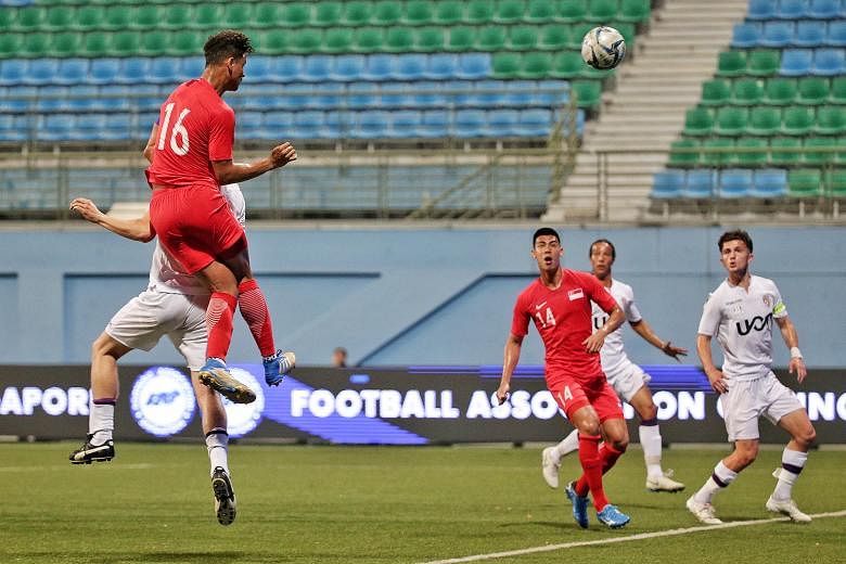 Singapore Under-22 captain Irfan Fandi heading home a goal in the 4-1 friendly win over Perth Glory's U-20 team during their match at the Jalan Besar Stadium last night. ST PHOTO: KEVIN LIM