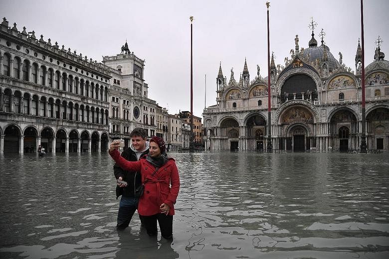 St Mark's Square was flooded after an exceptional overnight "acqua alta", or high waters, early yesterday in Venice.