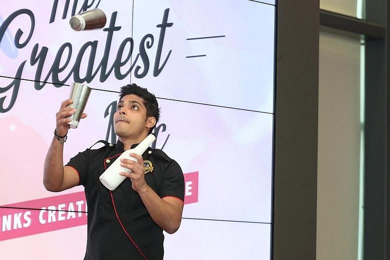 Bartender Umar Feroz Khan, 30, performing a flairing routine, where he juggles bottles and shakers, during The Greatest Mix - F&N Drinks Creation Challenge yesterday. The challenge, co-organised by ITE College West School of Hospitality and F&N Foods