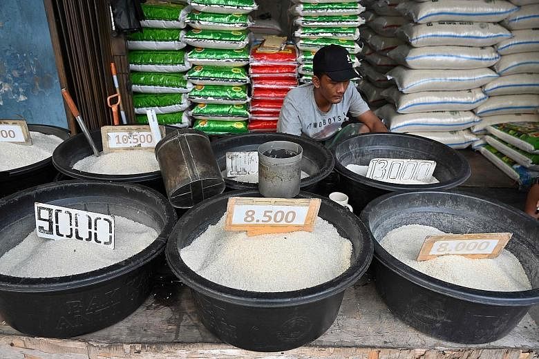 Rice has been woven into the culinary fabric of Indonesians, whose former president Suharto transformed it into a must-have meal. Indonesians now gobble down rice at a rate almost three times the global average of 53kg annually. PHOTO: AGENCE FRANCE-