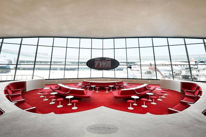The interior of the TWA Hotel at John F. Kennedy International Airport features sweeping asymmetrical arches and lofty curved ceilings.