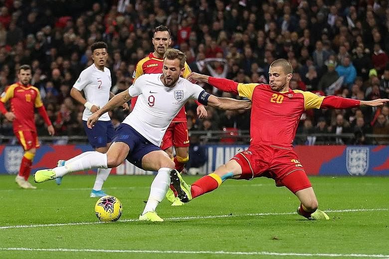 Harry Kane scoring England's fifth goal to complete his hat-trick against Montenegro in their World Cup qualifier at Wembley on Thursday. It was his 11th goal in seven Group A matches. 