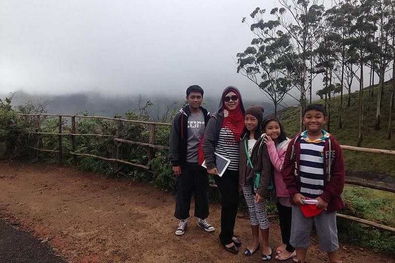 Madam Nur Azah Ismail with her four children (from left): Izz Amsyar, Iffah Irdina, Ilya Insyirah and Irfan Afiq, in Munnar, a town in India's Kerala state. The family lived in Chennai for about two years because of their father's work posting.