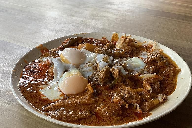 The R.K. Special comes with two pieces of crispy plain prata drenched in mutton curry and topped with two wobbly soft-boiled eggs.