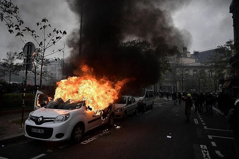 "Yellow vest" protesters at Place d'Italie in Paris yesterday, during a demonstration marking the first anniversary of the movement, which has lost strength in recent months.