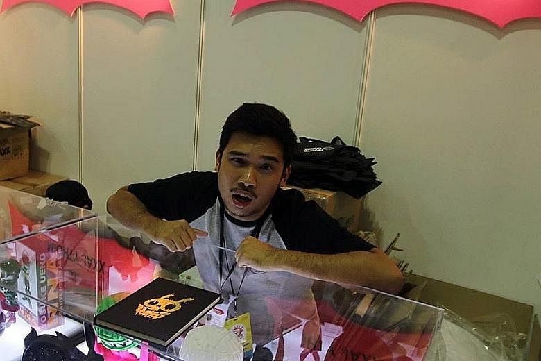 Mr Aw at the Mighty Jaxx booth at the Singapore Comic Convention in 2015. From a humble start, he now employs 45 staff and has a new, funkily furnished 6,500 sq ft office in Tai Seng industrial estate. Mr Jackson Aw, 30, started his collectible toy b