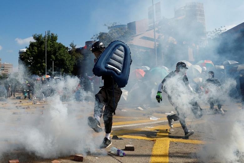 Hong Kong protesters hurl petrol bombs in fresh university clashes ...