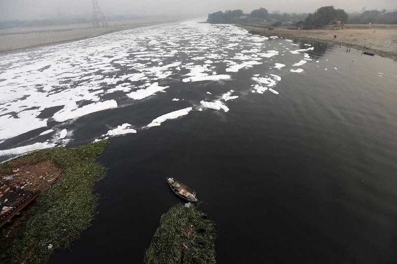 India’s Yamuna river, known as one of the world’s most polluted rivers, covered with toxic foam caused by industrial waste last Tuesday. Investors can correlate environmental themes, like pollution and climate change, with returns.