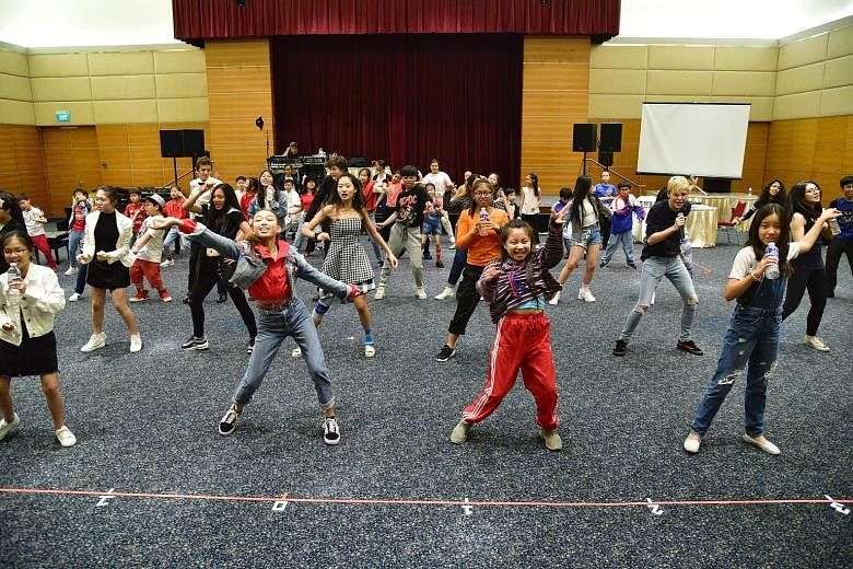 The young performers rehearse the ChildAid finale, Justin Timberlake's Can't Stop The Feeling, at Singapore Press Holdings' News Centre auditorium.