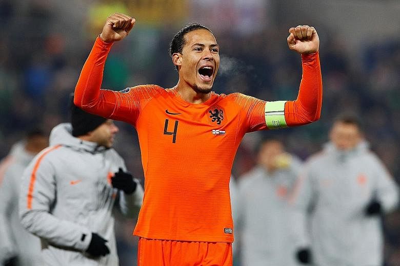 Skipper Virgil van Dijk celebrating after the Netherlands qualified for Euro 2020, the first major tournament they have reached since the 2014 World Cup. He will miss tomorrow's final qualifier against Estonia for "personal reasons". The Dutch escape