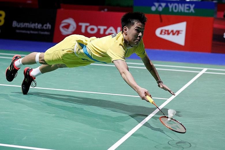 Lee Cheuk Yiu diving to retrieve a drop shot at the World Championships in August. The unheralded Hong Konger, who appeared to back the pro-democracy protests after his opening match on Wednesday, survived championship point to pull off an upset win 