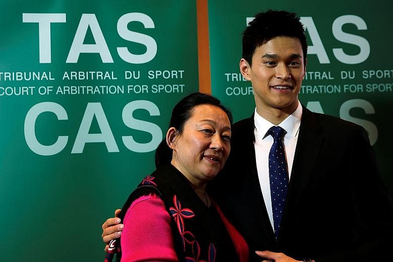 Sun Yang with his mother Yang Ming after Friday's hearing of his case at the Court of Arbitration for Sport. A decision is expected early next year.