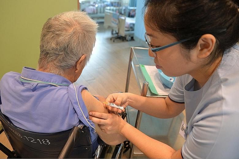 A nurse injecting the pneumococcal vaccine into an elderly resident at MWS Bethany Nursing Home - Choa Chu Kang. One dose of each of the PCV13 and PPSV23 vaccines is recommended to help keep the disease at bay.