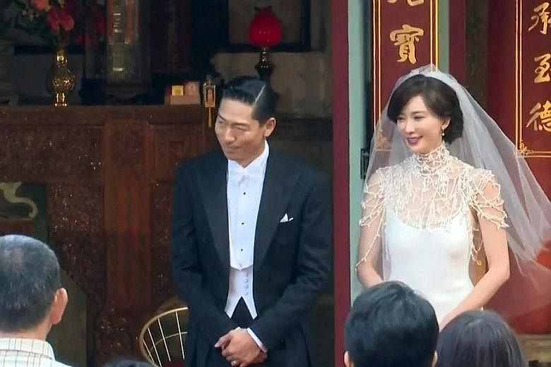 The newly married couple sharing a kiss. Taiwanese model Chiling Lin and Japanese singer-actor Akira at their wedding ceremony in Tainan.
