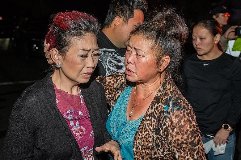 People in tears near the scene of the shooting in Fresno, California, on Sunday. Police said there was no indication it was gang-related.