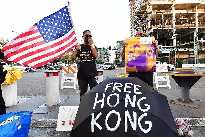 Supporters of Hong Kong's pro-democracy protesters rallying outside Los Angeles' Staples Centre, ahead of a National Basketball Association game late last month. The US Senate on Tuesday unanimously passed the Hong Kong Human Rights and Democracy Act