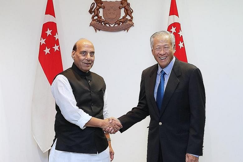 Defence Minister Ng Eng Hen with his Indian counterpart Rajnath Singh at the Ministry of Defence yesterday. Mr Singh said he was confident that both countries will enter a new era of defence partnership.