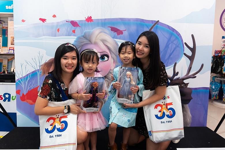 Elsa Chia (third from far left) with her mother Lim Yue Wei (fourth from far left) and her cousin's family at toy retailer Toys "R" Us' VivoCity branch for a Frozen 2 event recently. Graphic designer David Hilman has spent close to $6,000 on Frozen m