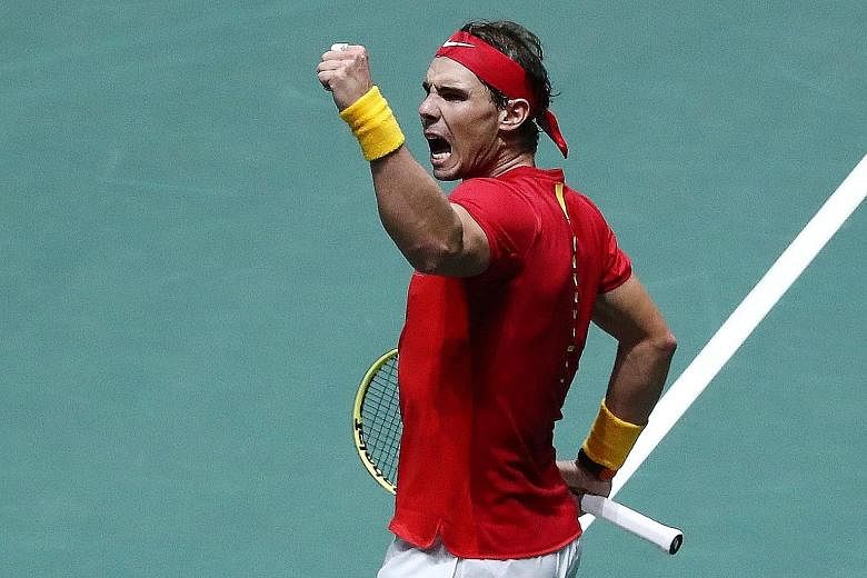 A fired-up Rafael Nadal after taking a point for Spain against Russia's Karen Khachanov in their Davis Cup Finals group-stage match at Caja Magica in Madrid. PHOTO: REUTERS