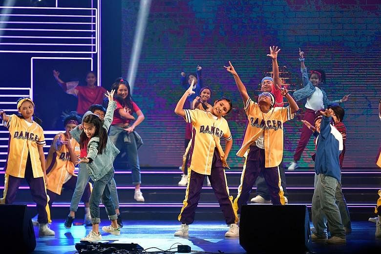 Danz People and Stylo Mylo performing at the end of their hip-hop battle. The funds raised from ChildAid will go towards The Straits Times School Pocket Money Fund and The Business Times Budding Artists Fund. 