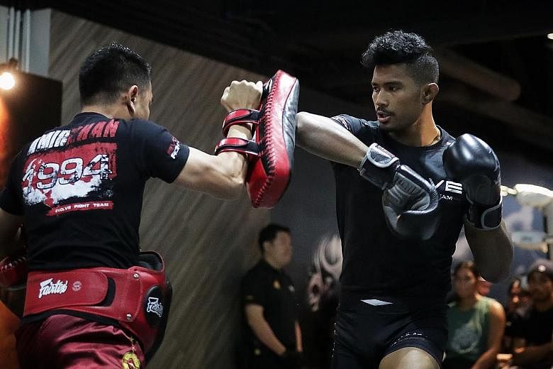 Singapore MMA fighter Amir Khan during the open workouts on Tuesday. He will fight Malaysia's Ev Ting in a lightweight bout, a co-main event at One Championship's Edge of Greatness event today. ST PHOTO: GIN TAY