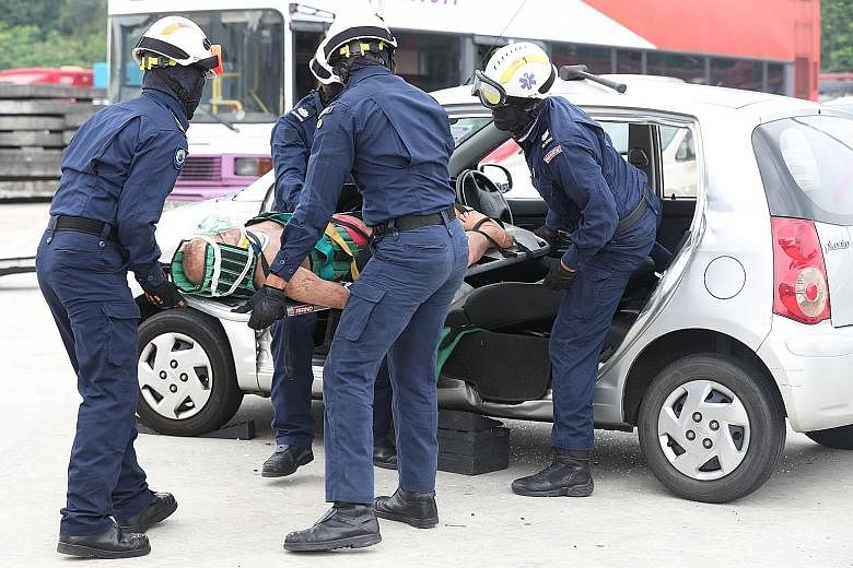 A four-member team responding to a road "accident" and extricating a "casualty" trapped in a car, in what is known as the Rip-It-Off challenge. 