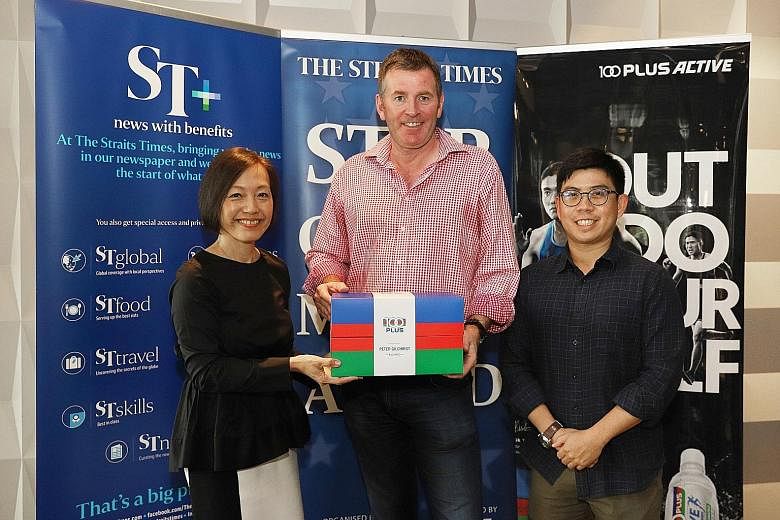 Peter Gilchrist receiving his award and prize from managing director of F&N Foods Jennifer See and ST assistant sports editor Jonathan Wong at HortPark. The billiards player, who has won world championships 25 years apart, hopes to emulate the late Fred D