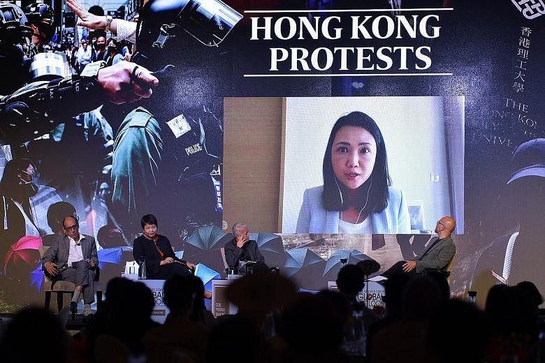 ST's Hong Kong correspondent Claire Huang, joining the panel at The Straits Times Global Outlook Forum via video conference yesterday. On stage were (from left) ST associate editor Vikram Khanna, OCBC Bank's head of treasury research and strategy Sel