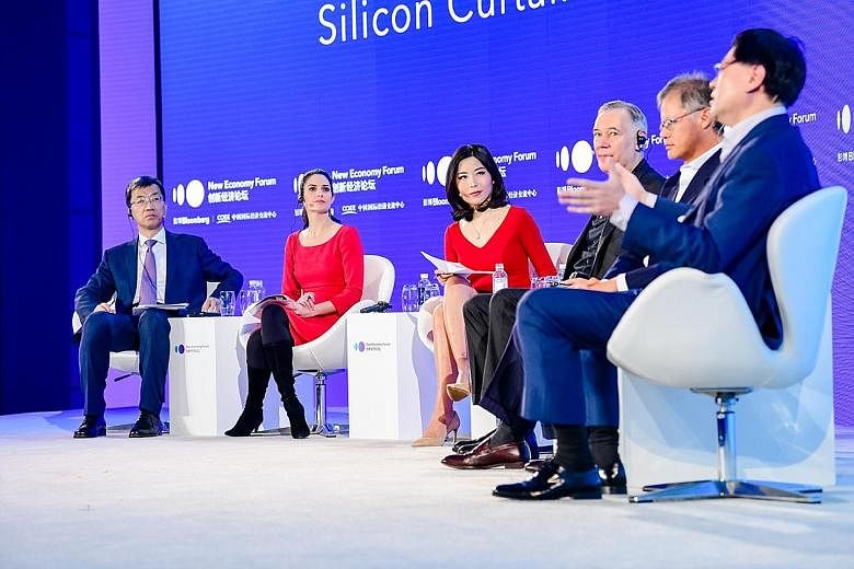 Lenovo chief executive Yang Yuanqing (far right) speaking at a panel discussion at the Bloomberg New Economy Forum in Beijing yesterday. With him were (from left) Mr Huai Jinpeng, executive vice-president of China Association for Science and Technolo