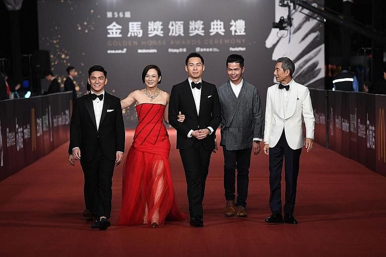 Yeo Yann Yann, who won Best Leading Actress for her role in Wet Season, with (from left) actor Koh Jia Ler, director Anthony Chen, producer Huang Wenhong and actor Yang Shi Bin. Singaporean film-maker Yeo Siew Hua won Best Original Screenplay award f