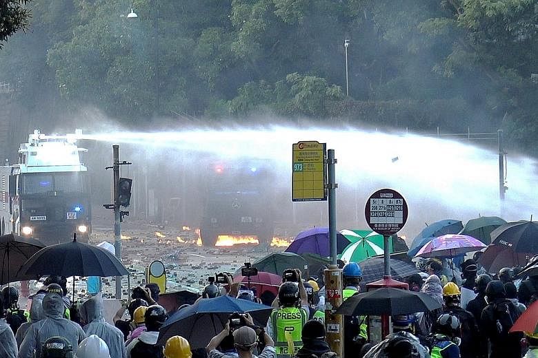Police using water cannon to spray at protesters at Hong Kong Polytechnic University, one of the universities in the city occupied by student protesters.