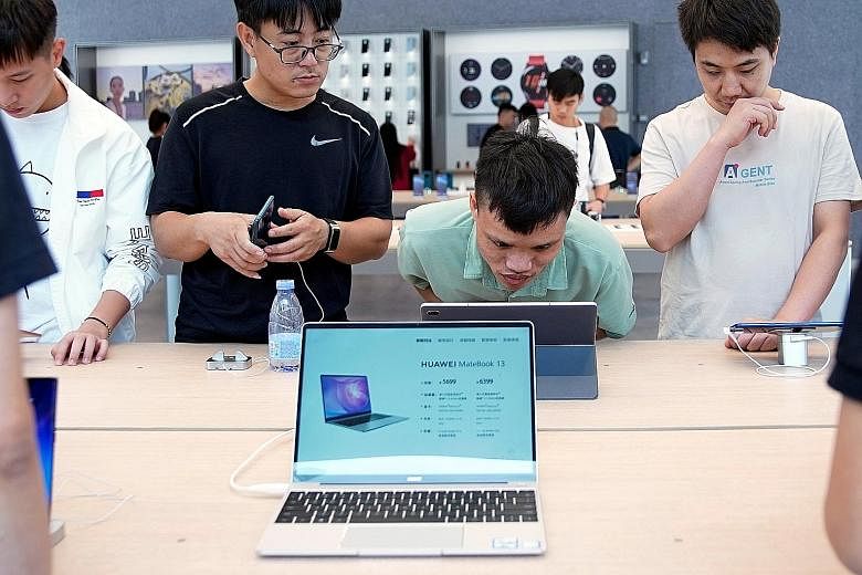 The US is set to impose 15 per cent additional tariffs on $213 billion of Chinese products on Dec 15, including video game consoles and computer monitors. PHOTO: REUTERS