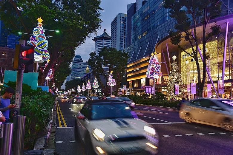 The festive lights along Orchard Road last Tuesday. The number of lights this year is the same as last year's - but they have been stretched over a larger area as new roads have been added to the Christmas light-up. This year's lights were switched o