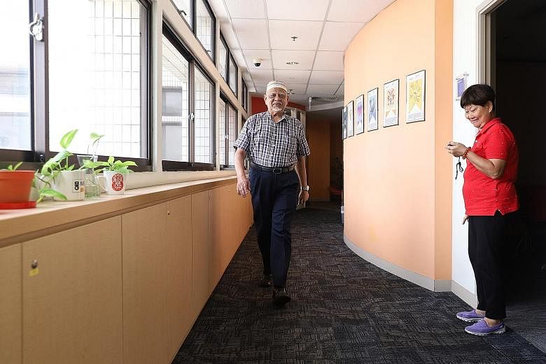 SingHealth Polyclinics clinical research coordinator Ng Chiat Eng measuring the walking speed of Mr Abdul Samad, 76, during a demonstration of sarcopenia assessment methods on Monday.