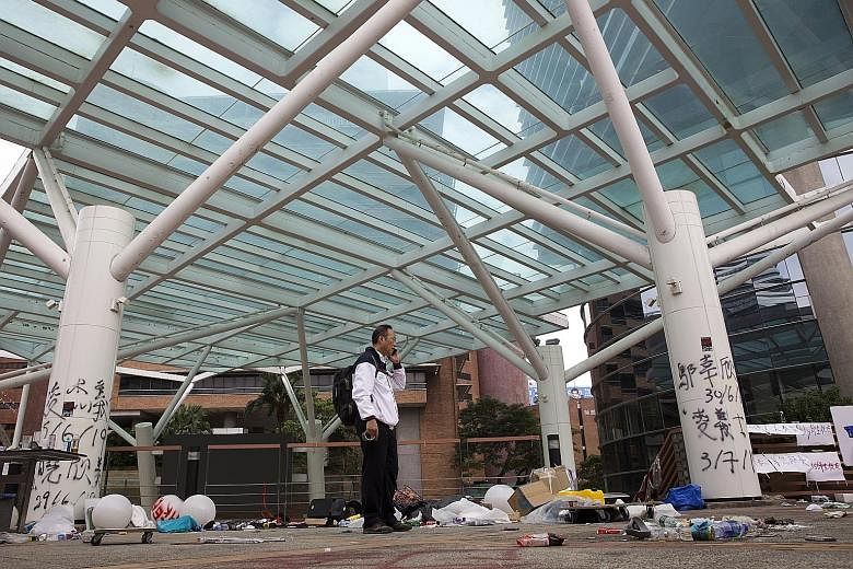 Above: Items left behind by protesters at The Hong Kong Polytechnic University (PolyU). Hundreds fled the campus following clashes that broke out on Nov 17 between police and protesters at the university. Left: PolyU vice-president Alexander Wai taki
