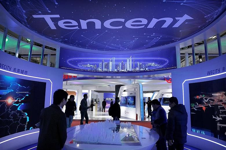 Alibaba's listing ceremony at the Hong Kong Stock Exchange on Tuesday, and Tencent's booth at the World 5G Exhibition in Beijing earlier this month. Hong Kong investors can now own shares in both Alibaba and Tencent after the e-commerce giant's local